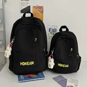 Classic black school backpack set with cute bear pendant, large capacity casual daypack.