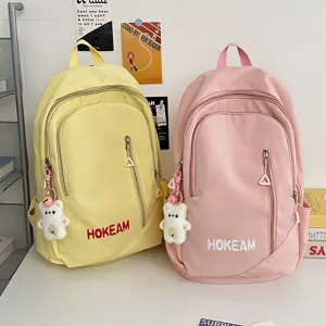 Large capacity solid color school backpack for students, stylish casual daypack for travel.