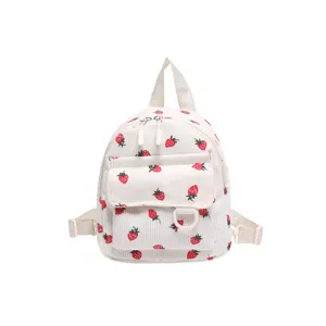Cute strawberry print corduroy mini backpack front view, sweet style casual daily bag.