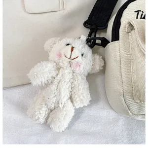 Korean style canvas crossbody bag for women with cute plush bear pendant, fashion casual design.