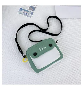 Small canvas crossbody bag for women, stylish green and white color block shoulder bag.