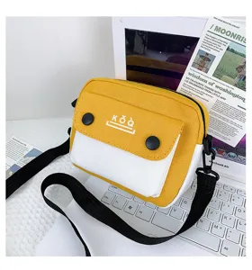 Yellow and white canvas crossbody bag for women, stylish contrast messenger bag with strap.