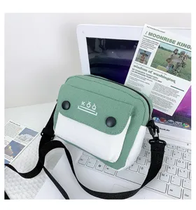 Green white canvas crossbody bag small shoulder handbag with contrast color front pocket design.