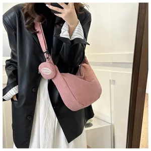 Trendy pink corduroy shoulder bag with small pouch for women, casual crossbody daily use.