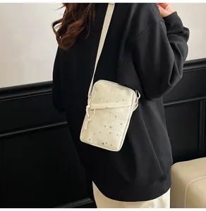 Detail view of the casual star pattern crossbody phone bag worn by model, perfect for daily use.