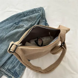 Casual corduroy shoulder bag for women, stylish crossbody handbag with adjustable strap.