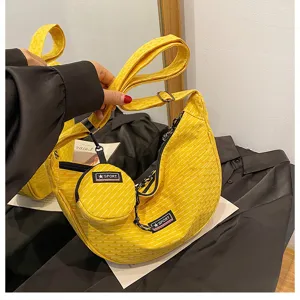 Casual yellow canvas dumpling crossbody bag with small coin purse, versatile daily shoulder bag for women