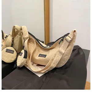 Casual canvas dumpling crossbody bag with small coin purse, trendy Japanese style daily shoulder bag.