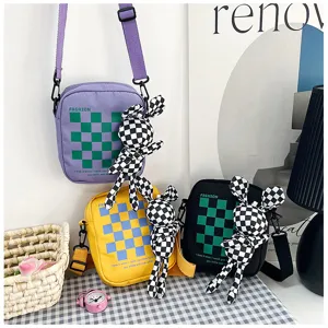 Fashion plaid color block canvas cross-body bag with cute rabbit pendant for casual daily use.