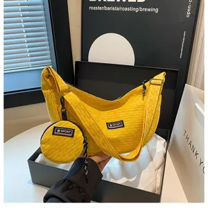 Yellow canvas dumpling crossbody bag with small coin purse, casual commuter shoulder bag.