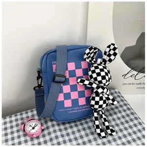 Fashion colorblock canvas shoulder bag detail, stylish plaid student crossbody handbag.