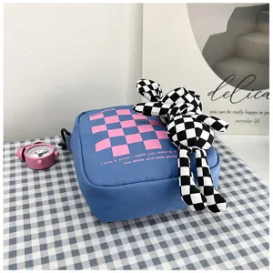 Checkered canvas shoulder bag with cute rabbit pendant, stylish student casual crossbody bag.