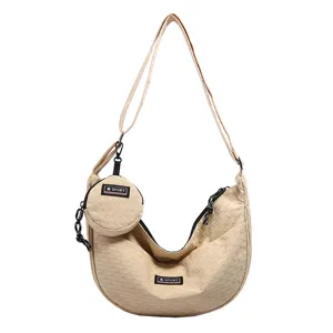 Japanese canvas dumpling crossbody bag, casual large capacity shoulder bag for daily use.