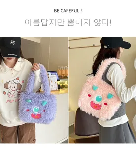 Cute plush monster fuzzy handbag for women, soft furry shoulder bag with funny face design.
