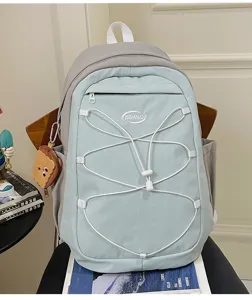 Korean style canvas casual backpack with drawstring and cute toast pendant, large capacity school bag.