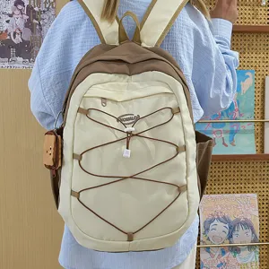 Trendy casual backpack with bungee cord design, large capacity daily school bag.