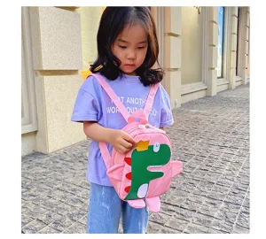 Detailed scene view of a cute pink toddler school backpack with a fun cartoon dinosaur motif.