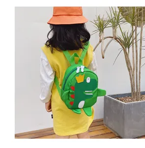 Detailed view of cute cartoon dinosaur children backpack, green canvas school bag for kids.