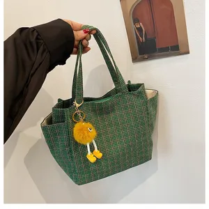 Green knitted tote bag for women, large capacity shoulder handbag with cute plush doll charm.