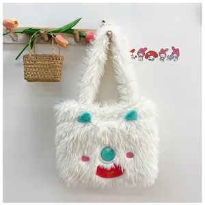 Fluffy white monster tote bag detail, featuring cute single-eye and soft plush texture.