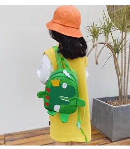 Cute dinosaur kids backpack detail showing the funny crown and soft dorsal fin design.
