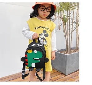 Cute dinosaur detail children backpack, black fabric with green cartoon animal design.