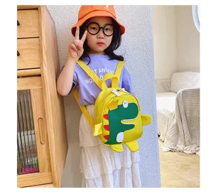 Detailed view of cute cartoon dinosaur kids backpack, lovely yellow and green toddler school bag.