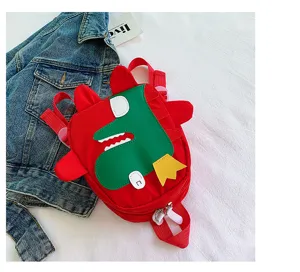 Details of the cute red children cartoon dinosaur backpack, featuring funny green dinosaur design.