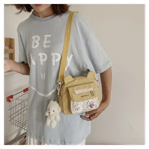 Nylon small shoulder bag sweet cute girl student messenger bag with bear ears and cute plush pendant.