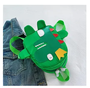 Detailed closeup of a cute green dinosaur cartoon children backpack with vibrant colors and fun spikes.