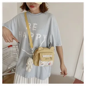 Cute yellow nylon crossbody bag for women, sweet bear ear design with plush pendant student.