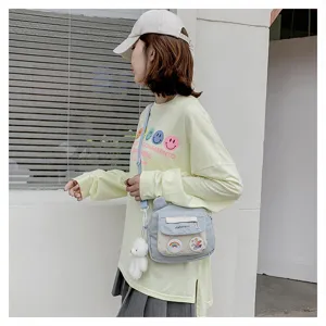 Nylon crossbody bag for women, cute sweet style shoulder bag with bear pendant and front pocket.
