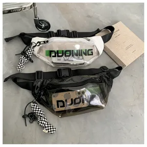 Clear PVC waist bag with black strap and checkered pendant, trendy streetwear detail view.