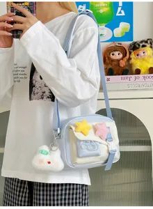Cute ins style canvas crossbody bag with plush star and bunny pendant for daily casual student use.