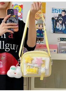 Cute yellow crossbody bag with plush star charms and rabbit pendant, sweet style casual.