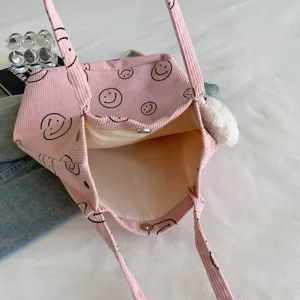 Pink corduroy tote bag featuring black smiley print, large capacity casual daily shoulder bag.
