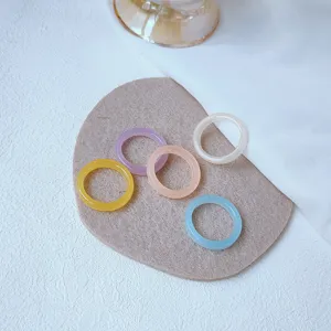 Colorful resin ring detail shot, minimalist stackable fashion finger rings for women.
