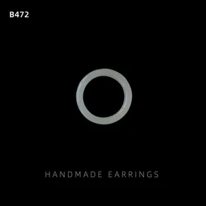 Minimalist resin round ring detail close-up shot featuring smooth simple texture design.