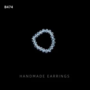 Detailed view of the clear beaded ring showing transparent crystal texture and handmade style.