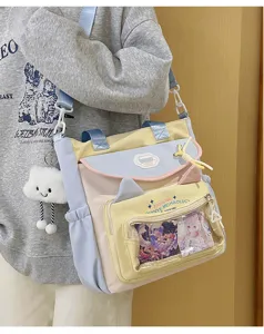 Detailed view of the cute pastel kawaii pain bag with transparent pocket and cat ears design.