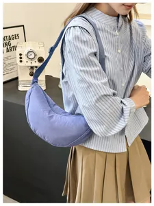 Versatile purple crescent shoulder bag, stylish casual dumpling underarm bag for daily use.