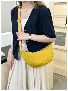 Yellow nylon crescent shoulder bag, casual crossbody dumpling bag for women daily use.