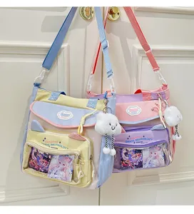 Cute canvas ita-bag shoulder bag with clear pocket, anime insert and plush cloud charm.