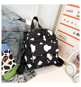 Kleine schwarz-weiße Kuhmuster Cord Rucksack modische lässige stilvolle Tagesrucksack für Damen