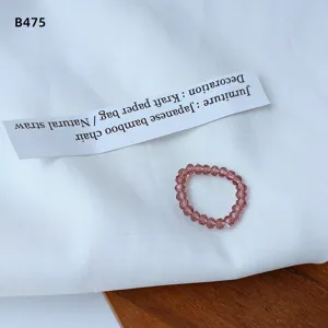 Close up detail shot of the beautiful pink crystal beaded elastic ring, showing sparkling facets.