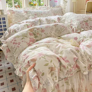 Cotton quilted bed skirt four piece set with fresh floral print and vintage lace ruffles.