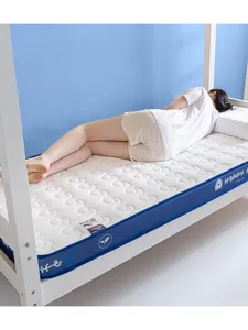 Student dormitory latex mattress detail, knitted fabric spinal support, comfortable sleeping pad.
