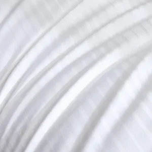 Close-up detail of white cotton satin striped fabric texture, soft bedding material showcase.
