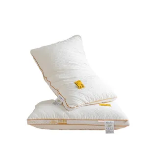 Soybean fiber quilted bed pillow pair with soft filling and supportive neck design for home bedroom use