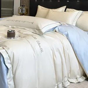 Juego de cama de lujo de algodón de alta densidad con bordado elegante para el dormitorio.